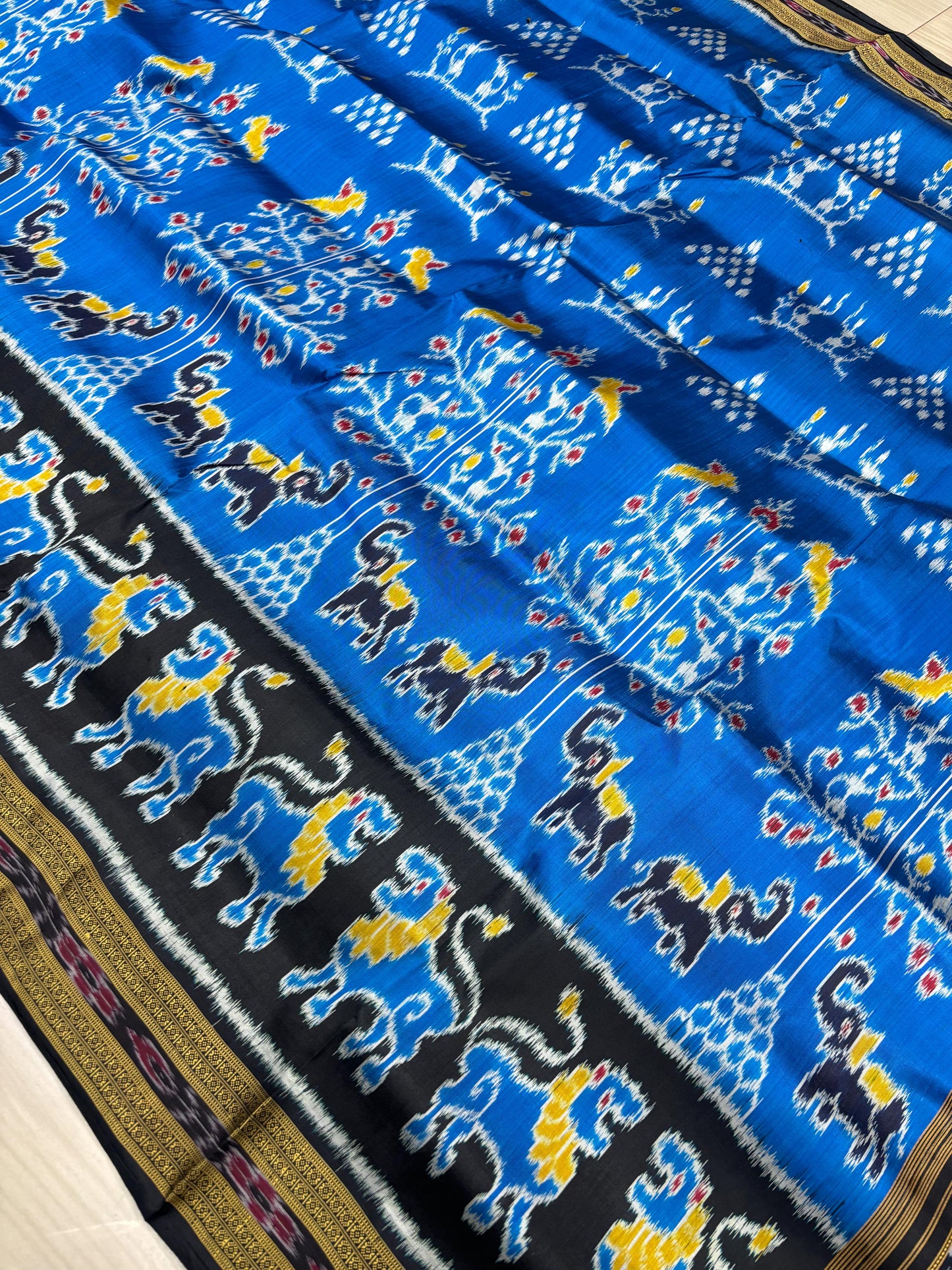 Lion scot with tribal khandua silk saree