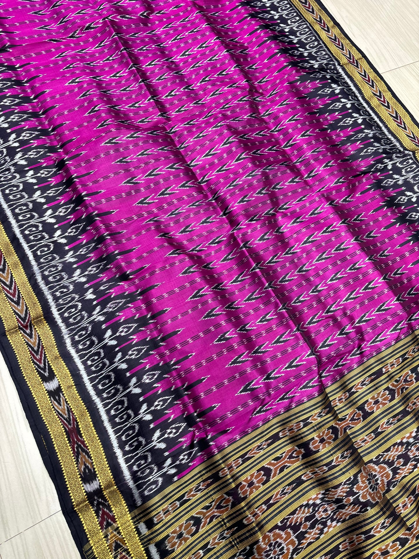 Rani with black Khandua pata saree