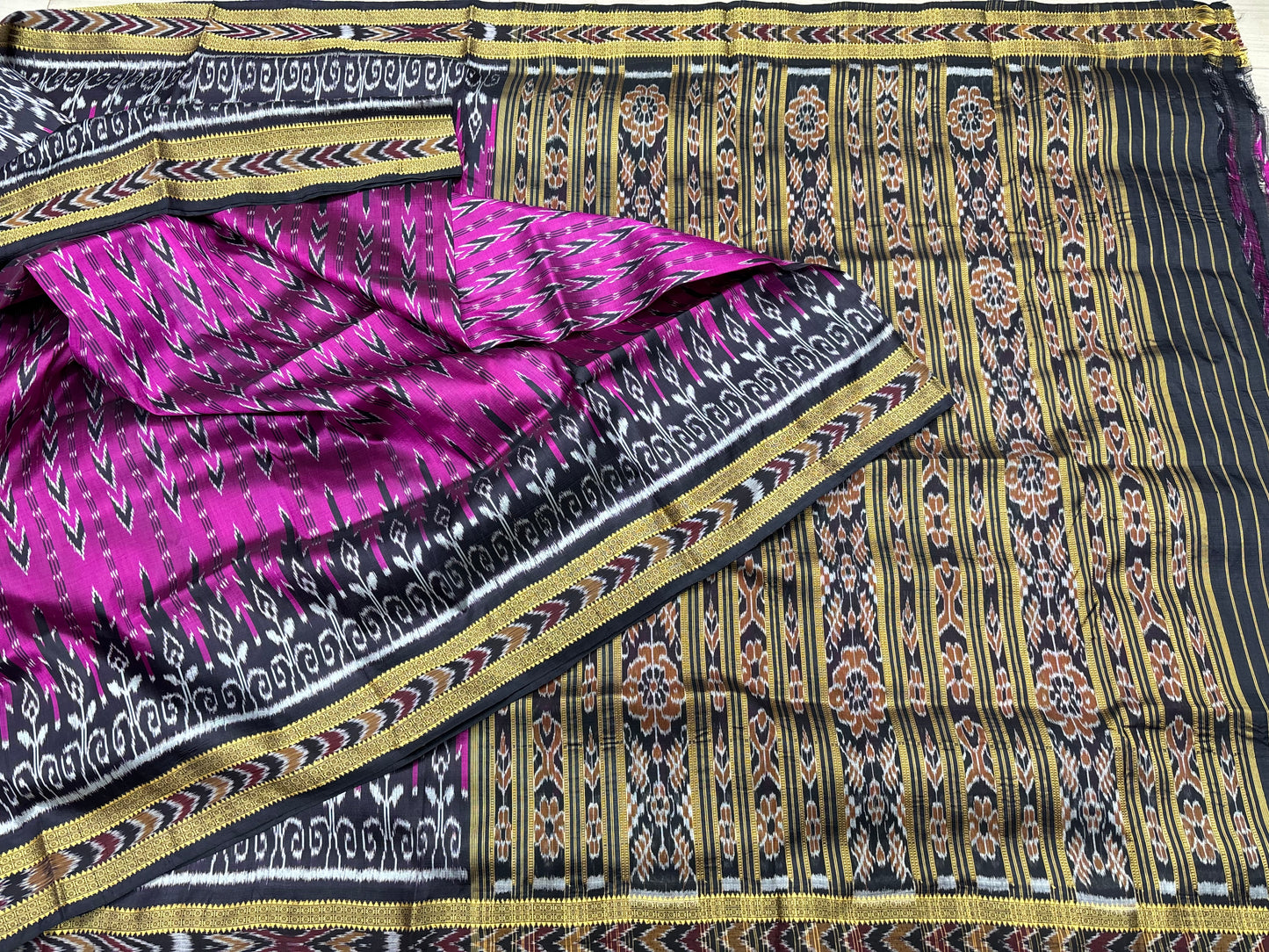 Rani with black Khandua pata saree