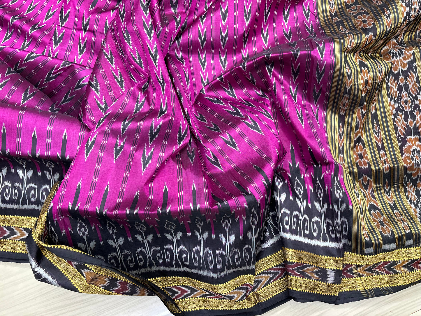 Rani with black Khandua pata saree