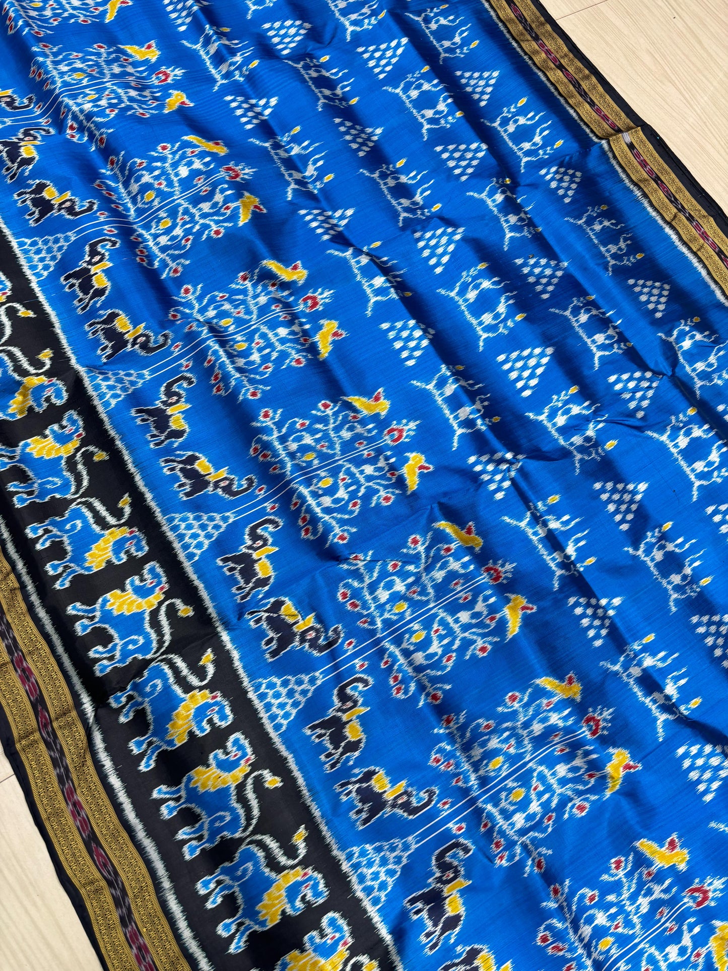 Lion scot with tribal khandua silk saree